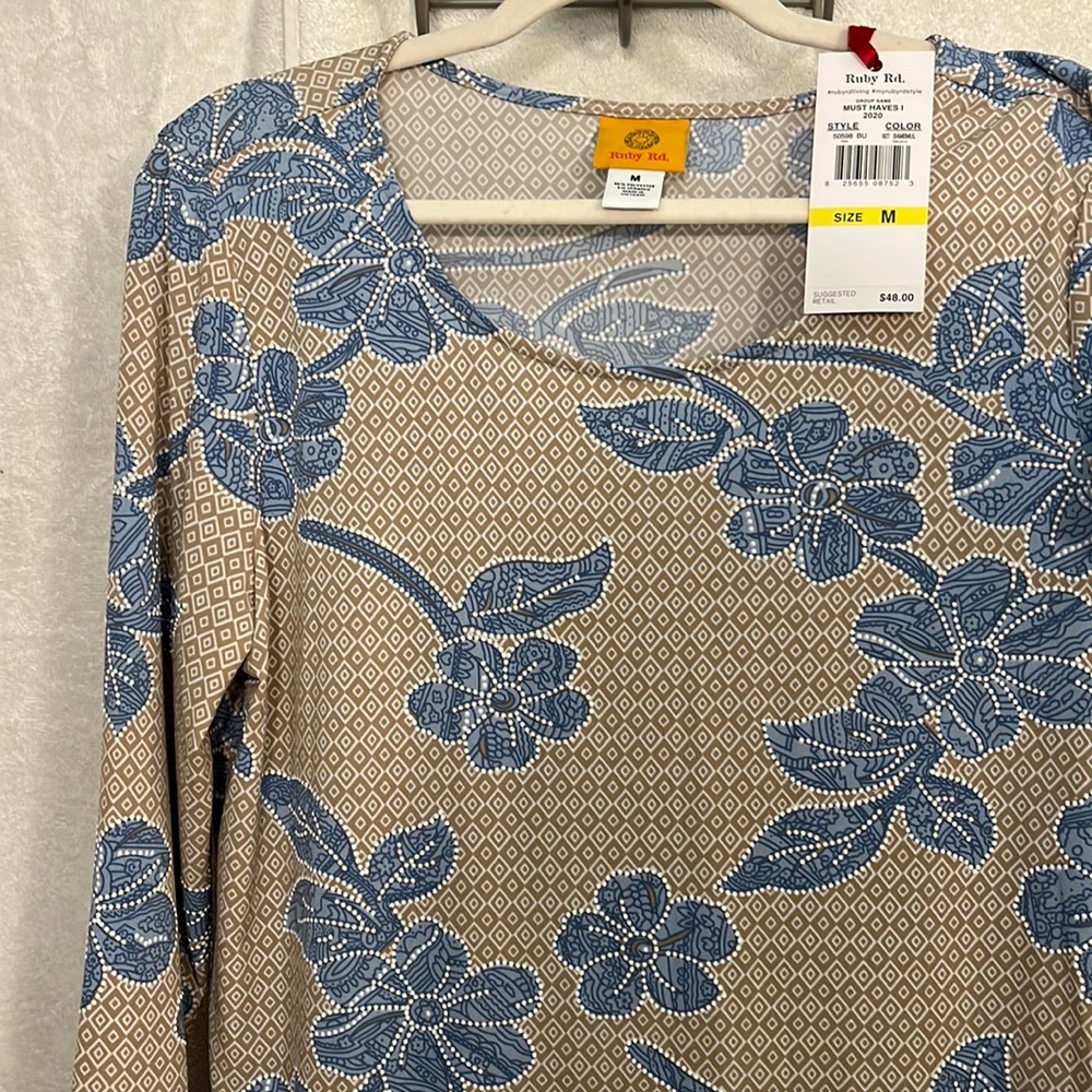 New with tags beautiful 3/4 sleeve lightweight Ruby Red top.
